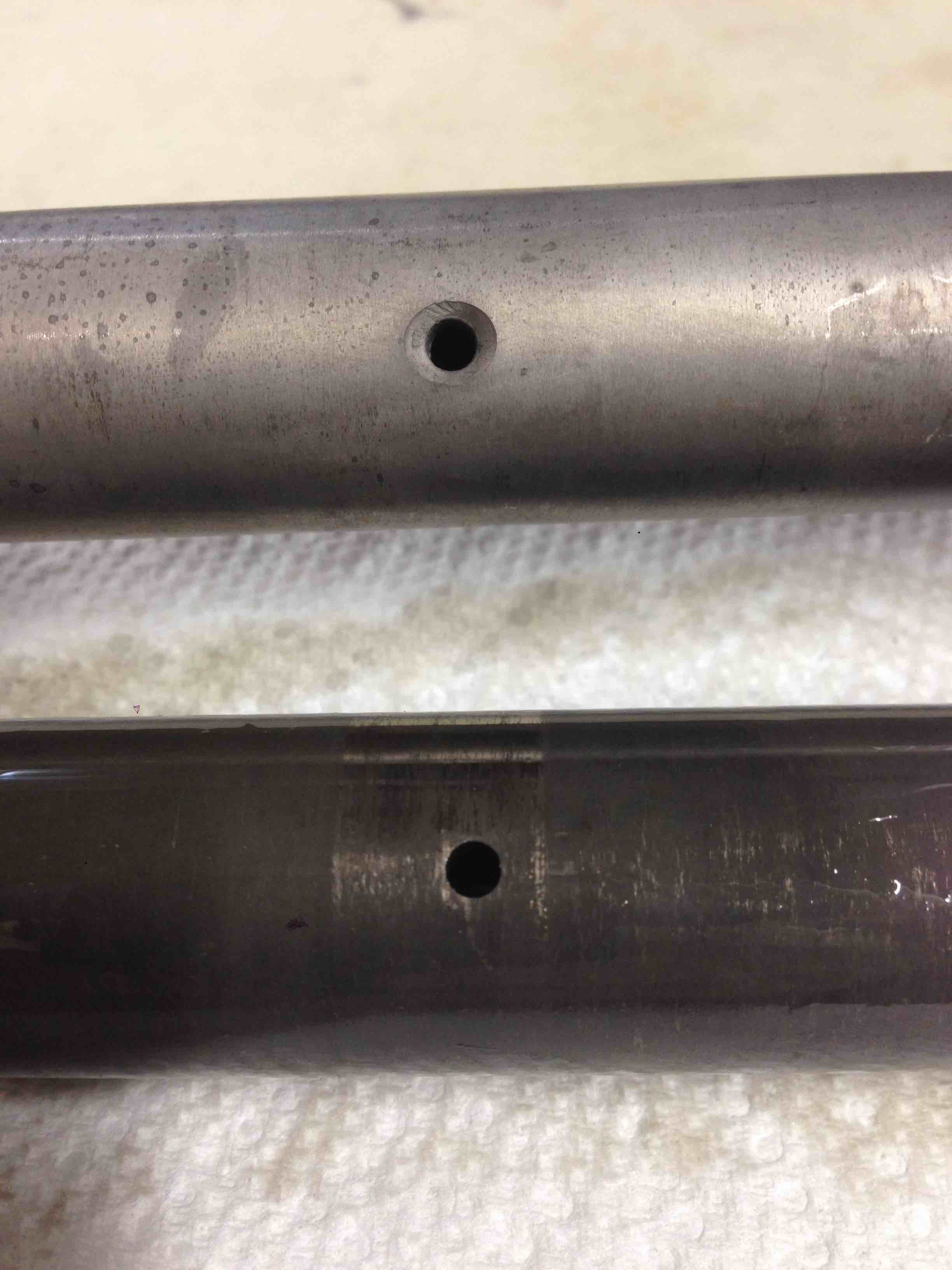 Attached picture New vs Old Rocker Shafts - valve tip oil hole.jpg